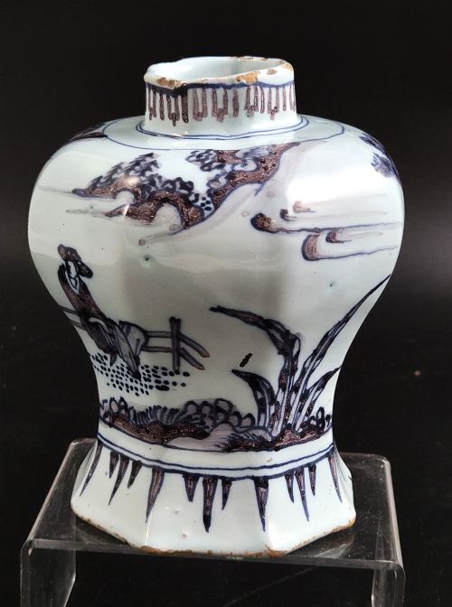 fig 1. An octagonal antique Dutch Delft tin-glazed earthenware baluster vase painted in blue and manganese depicting a Chinese scholar.