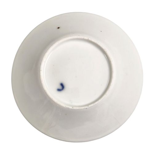 fig 2. A French Old Paris porcelain cup and saucer featuring gilded trim, interior gold wash, and hand-painted panels depicting rural figures.
