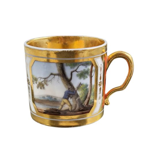 fig 3. A French Old Paris porcelain cup and saucer featuring gilded trim, interior gold wash, and hand-painted panels depicting rural figures.