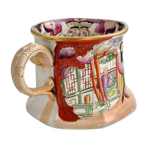 fig 3. An antique Masons ironstone cider mug featuring a red scale background, hand-painted Chinoiserie panels, a flared base, and a sculpted hydra handle.