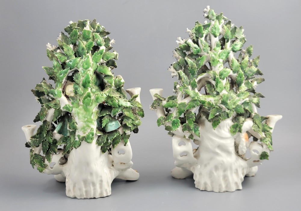 A pair of 18th-century English Derby porcelain candlestick figures depicting musicians surrounded by intricate floral bocage on Rococo scroll bases. View III