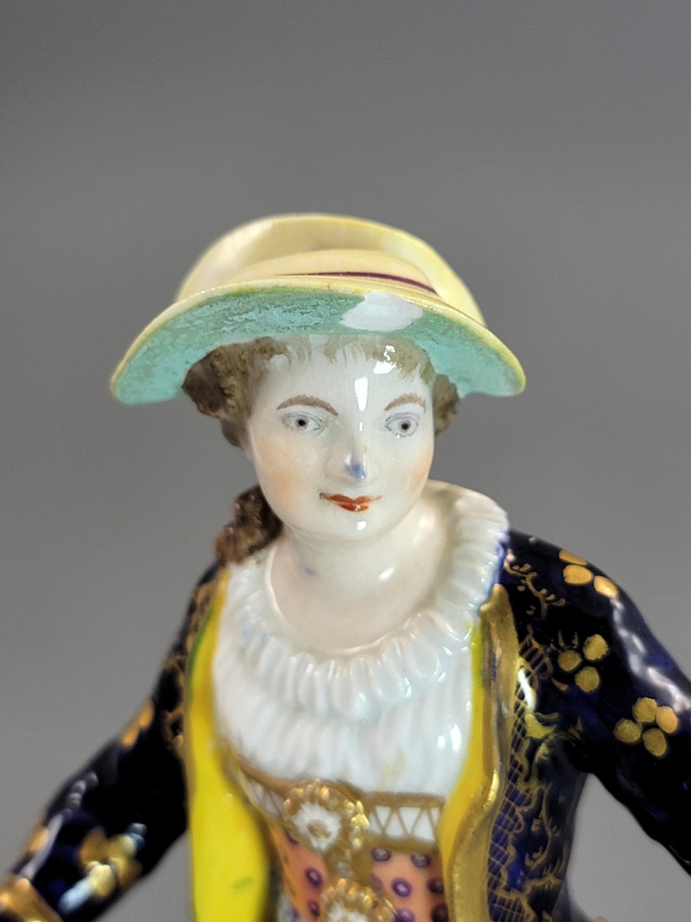 A pair of 19th-century Bloor Derby porcelain figurines depicting a shepherdess with a lamb and a shepherd with a dog, painted in multi-coloured enamels with gilded Rococo scroll bases. View VIII