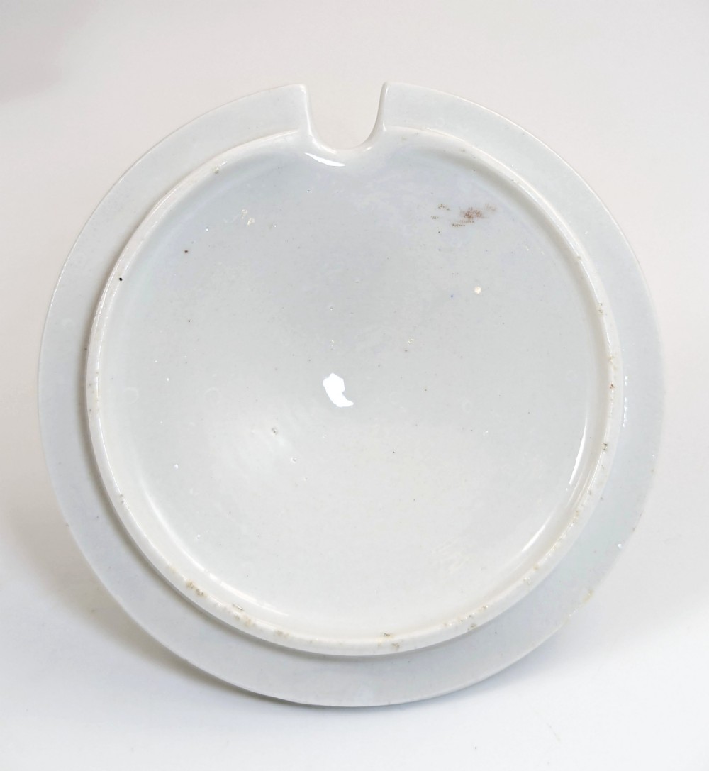 A Regency Flight, Barr and Barr Worcester white porcelain sauce tureen with lid, featuring gilt leaves, blue flowers, twin handles, and a square base. View VIII