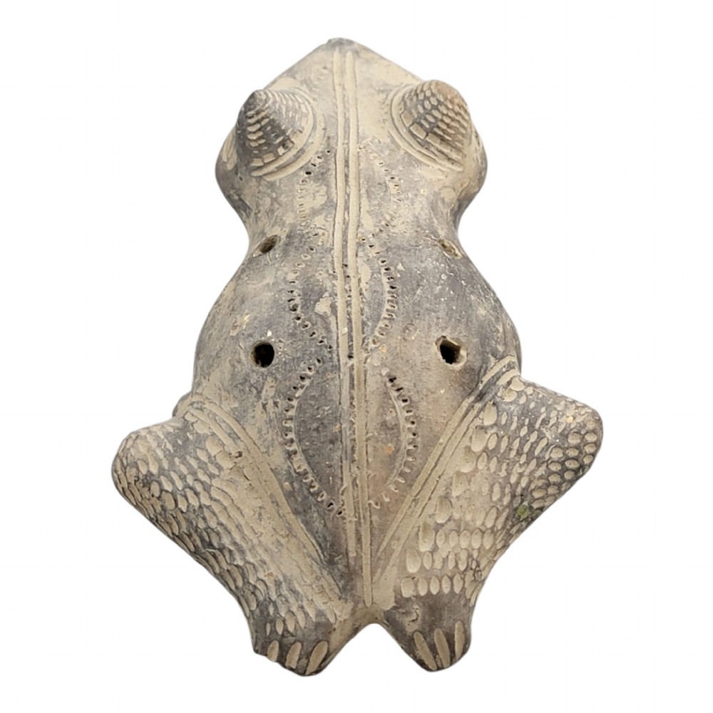A sculpted grey earthenware whistle shaped like a frog with incised line details and finger holes along its back. View III