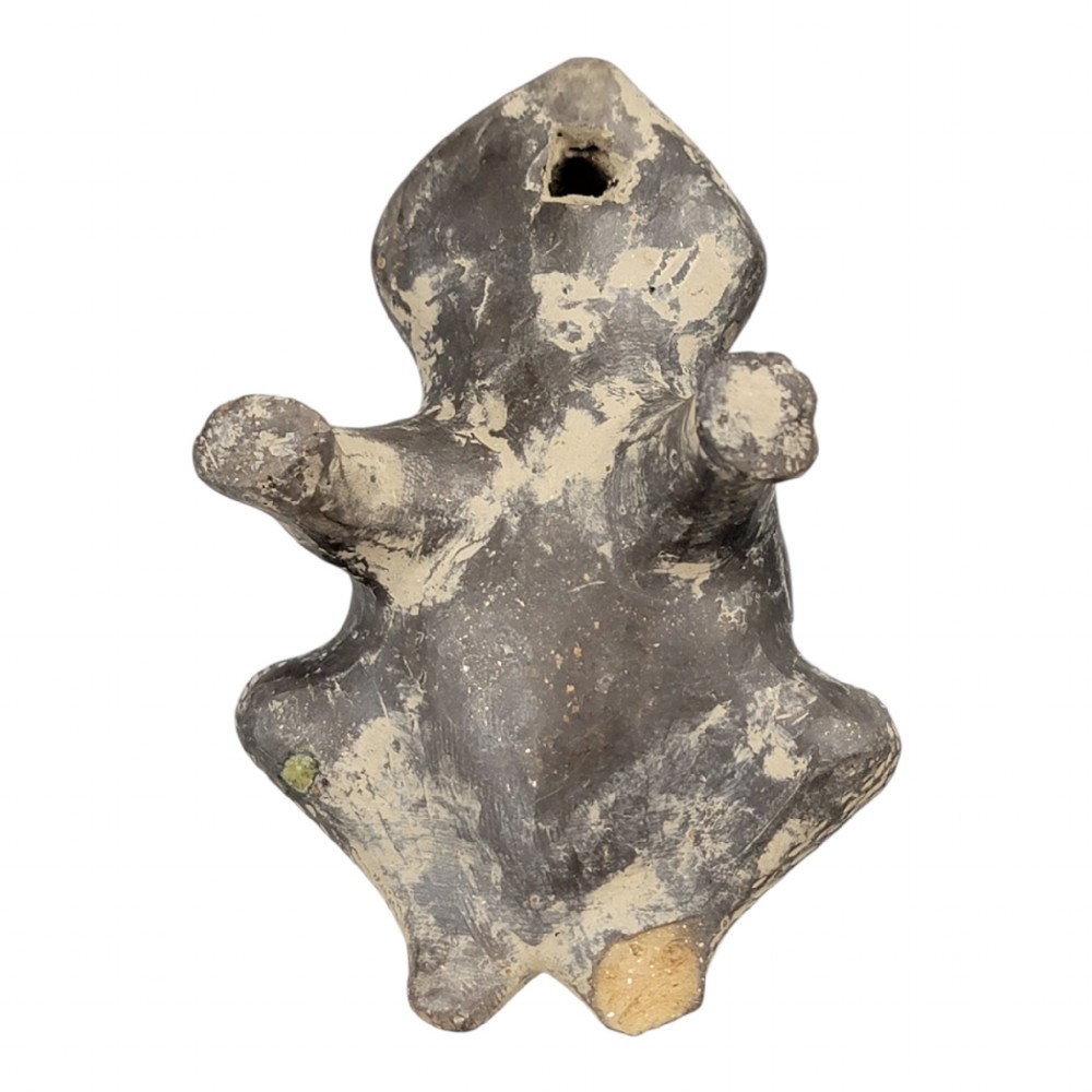 A sculpted grey earthenware whistle shaped like a frog with incised line details and finger holes along its back. View VII