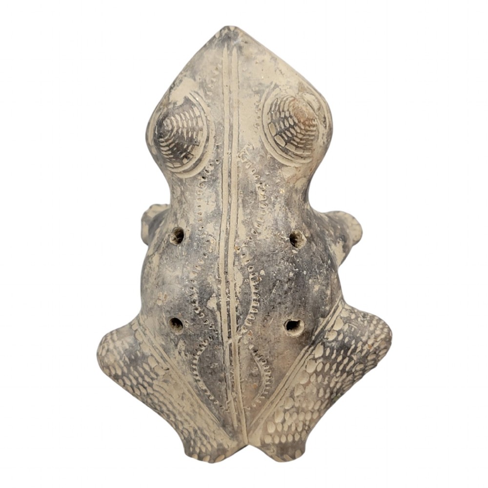 A sculpted grey earthenware whistle shaped like a frog with incised line details and finger holes along its back. View VIII