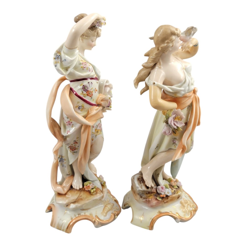 A pair of late 18th-century Volkstedt painted porcelain allegorical figures on ornate gilded scrollwork bases. View VII