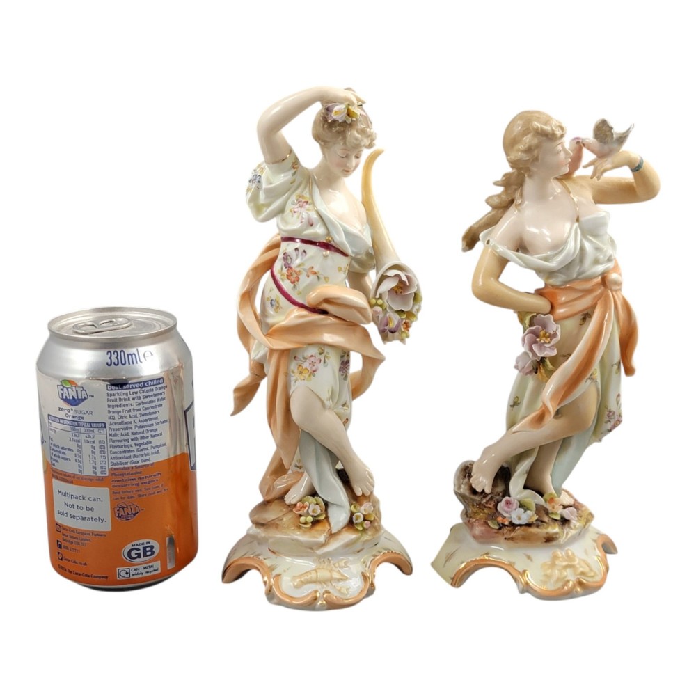 A pair of late 18th-century Volkstedt painted porcelain allegorical figures on ornate gilded scrollwork bases. View IX
