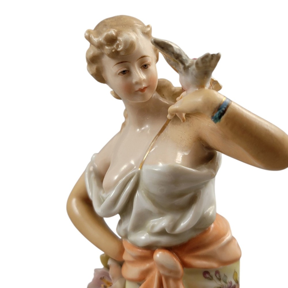 A pair of late 18th-century Volkstedt painted porcelain allegorical figures on ornate gilded scrollwork bases. View XV