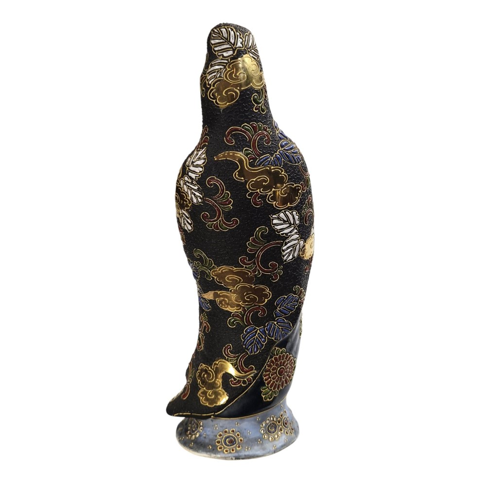A standing Japanese Kutani porcelain figurine of Kannon with detailed black and gold enamelled robes and a white glazed face. View III