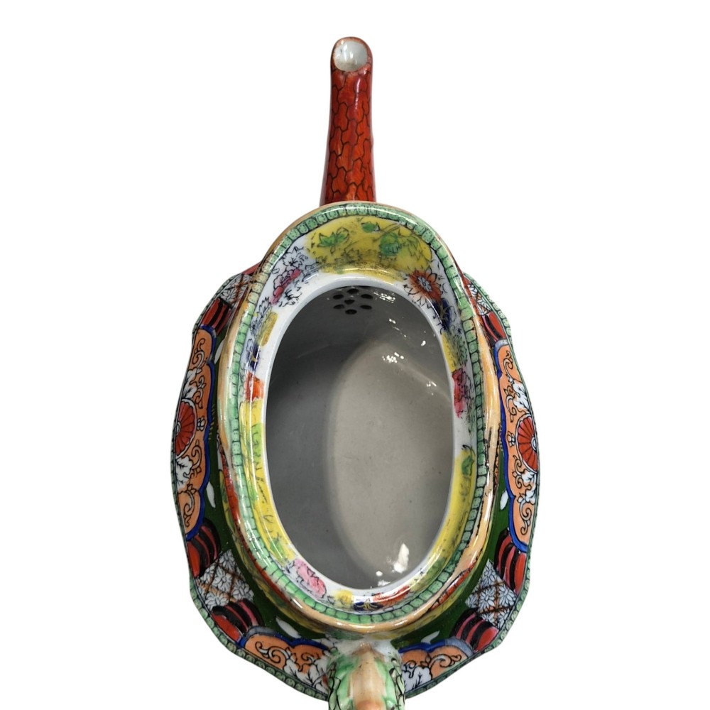 An antique Masons ironstone oval teapot featuring a red scale pattern and a hand-painted Chinoiserie scene with figures. View IX