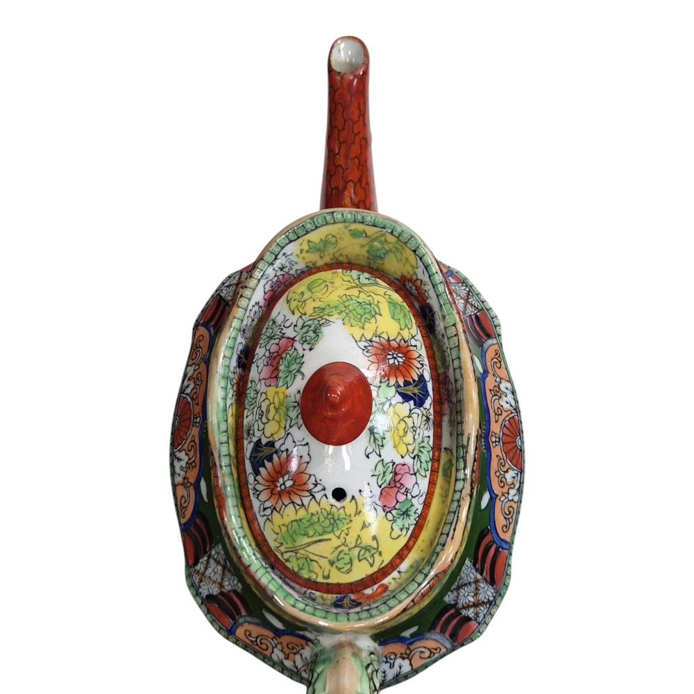An antique Masons ironstone oval teapot featuring a red scale pattern and a hand-painted Chinoiserie scene with figures. View X