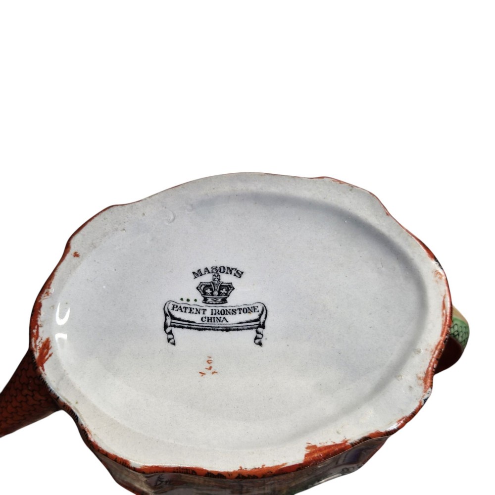 An antique Masons ironstone oval teapot featuring a red scale pattern and a hand-painted Chinoiserie scene with figures. View XI