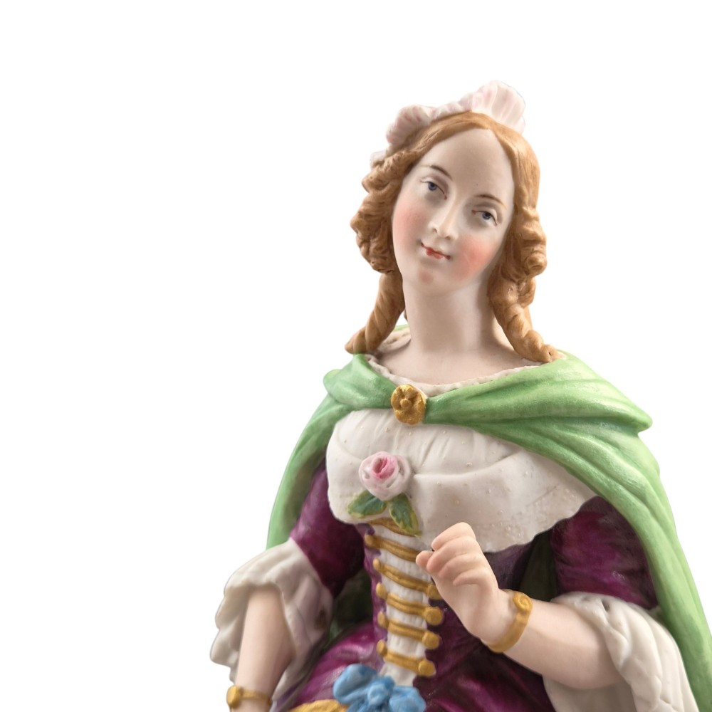 A pair of French biscuit porcelain figures depicting a male and female figure in 18th-century court costume with polychrome enamelled details. View VII