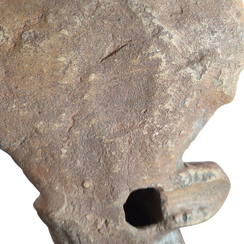 A Pre-Columbian earthenware terracotta sculpture depicting a seated female figure with a flared headdress, mounted on a rectangular dark wooden base. View V