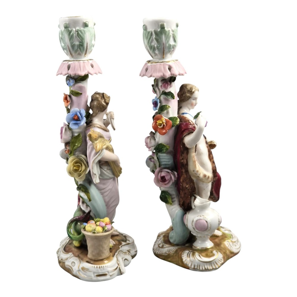 A pair of late nineteenth-century Volkstedt polychrome porcelain allegorical candlesticks depicting classical figures representing Summer and Autumn on rococo scroll bases. View IV
