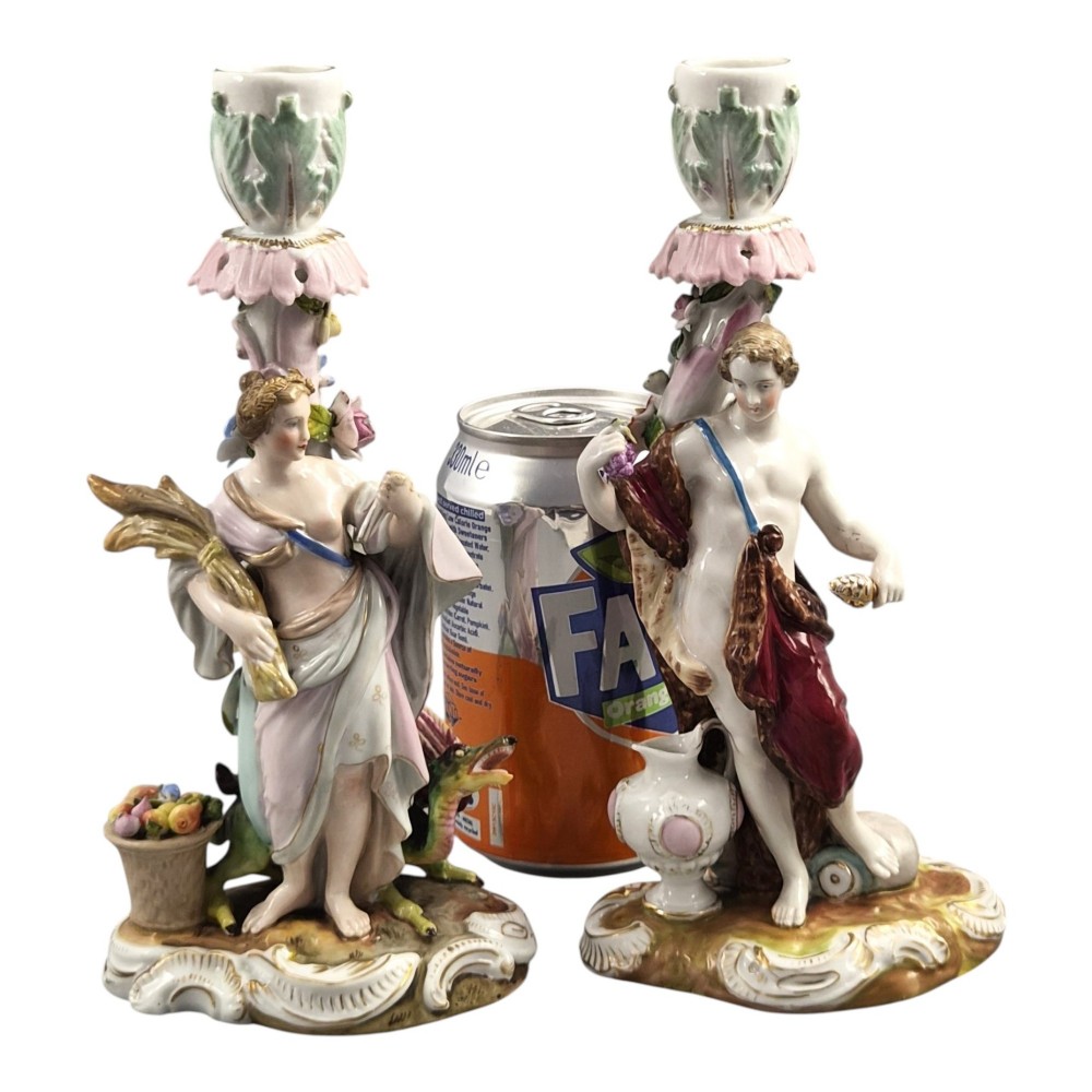 A pair of late nineteenth-century Volkstedt polychrome porcelain allegorical candlesticks depicting classical figures representing Summer and Autumn on rococo scroll bases. View VII