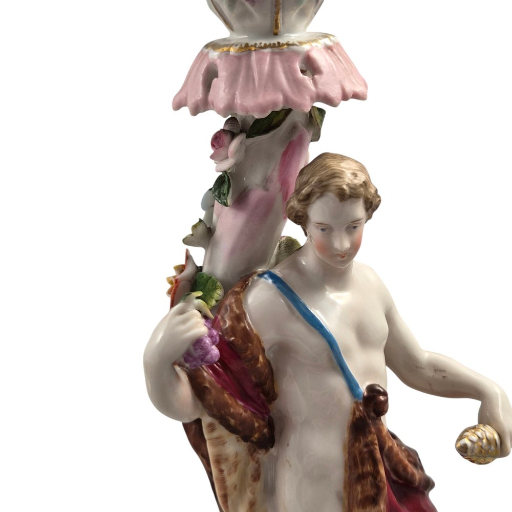 A pair of late nineteenth-century Volkstedt polychrome porcelain allegorical candlesticks depicting classical figures representing Summer and Autumn on rococo scroll bases. View VIII
