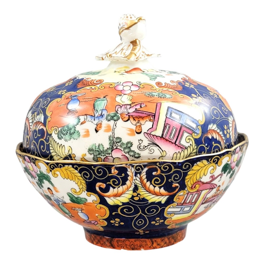 A Regency-era Masons Patent Ironstone lidded bowl decorated with elaborate Chinoiserie motifs in cobalt blue, orange, green, and gilt detailing. View II