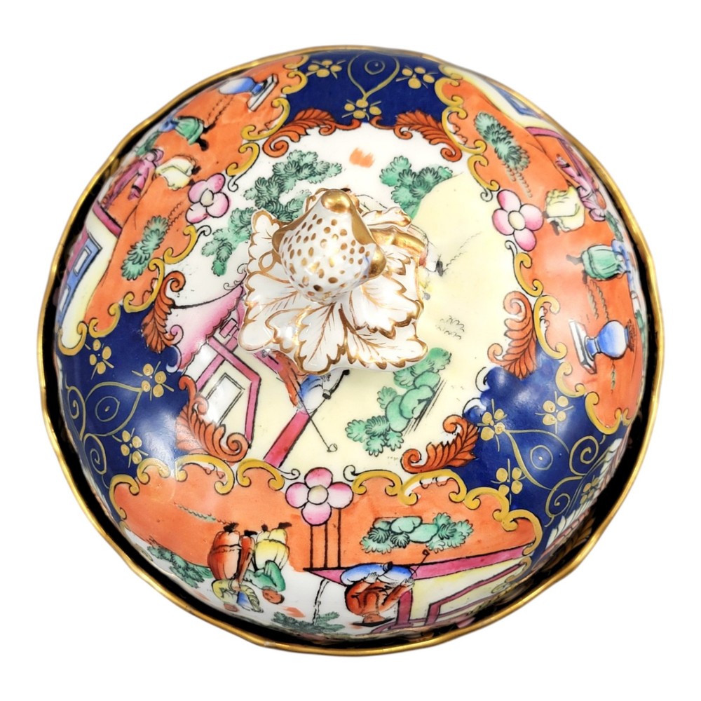 A Regency-era Masons Patent Ironstone lidded bowl decorated with elaborate Chinoiserie motifs in cobalt blue, orange, green, and gilt detailing. View VII
