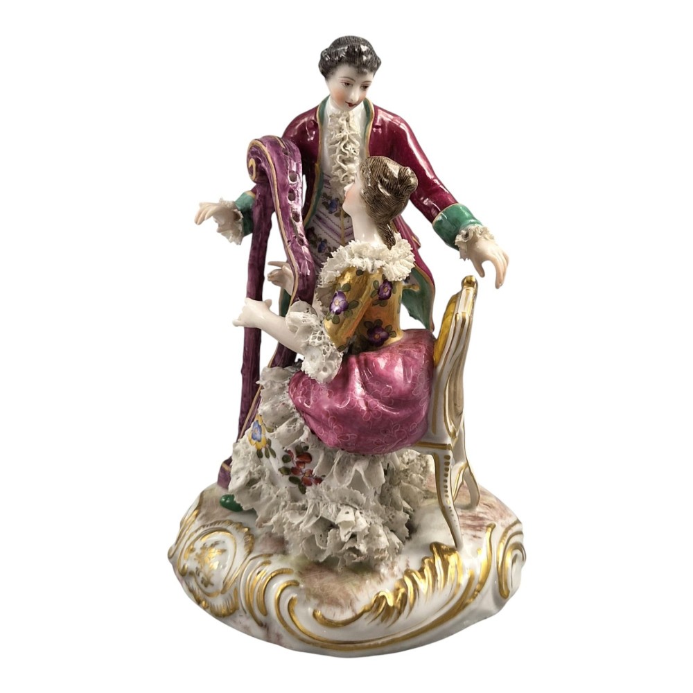 A 19th-century Paris porcelain figural group depicting a man standing behind a seated woman playing a harp, featuring porcelain lace trim and gold scrollwork. View II