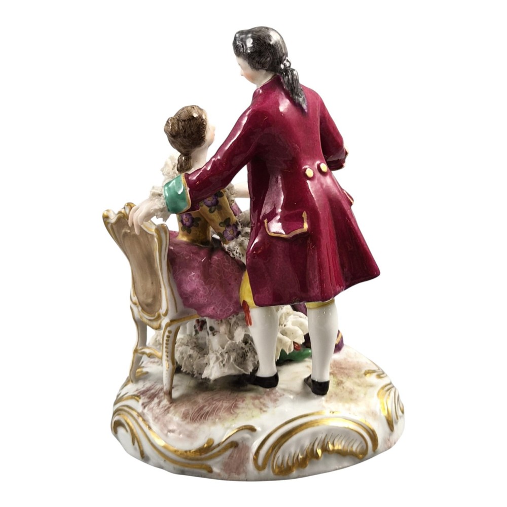 A 19th-century Paris porcelain figural group depicting a man standing behind a seated woman playing a harp, featuring porcelain lace trim and gold scrollwork. View IV