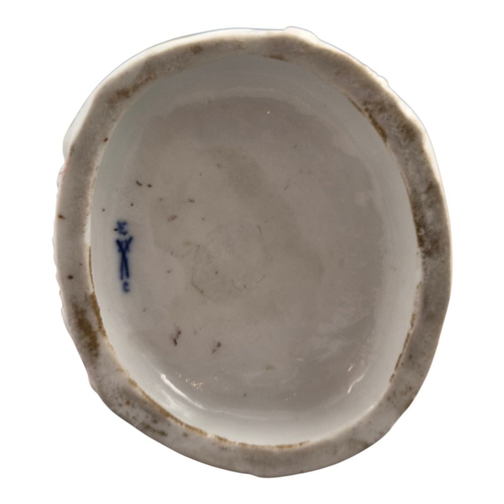 A 19th-century Paris porcelain figural group depicting a man standing behind a seated woman playing a harp, featuring porcelain lace trim and gold scrollwork. View IX
