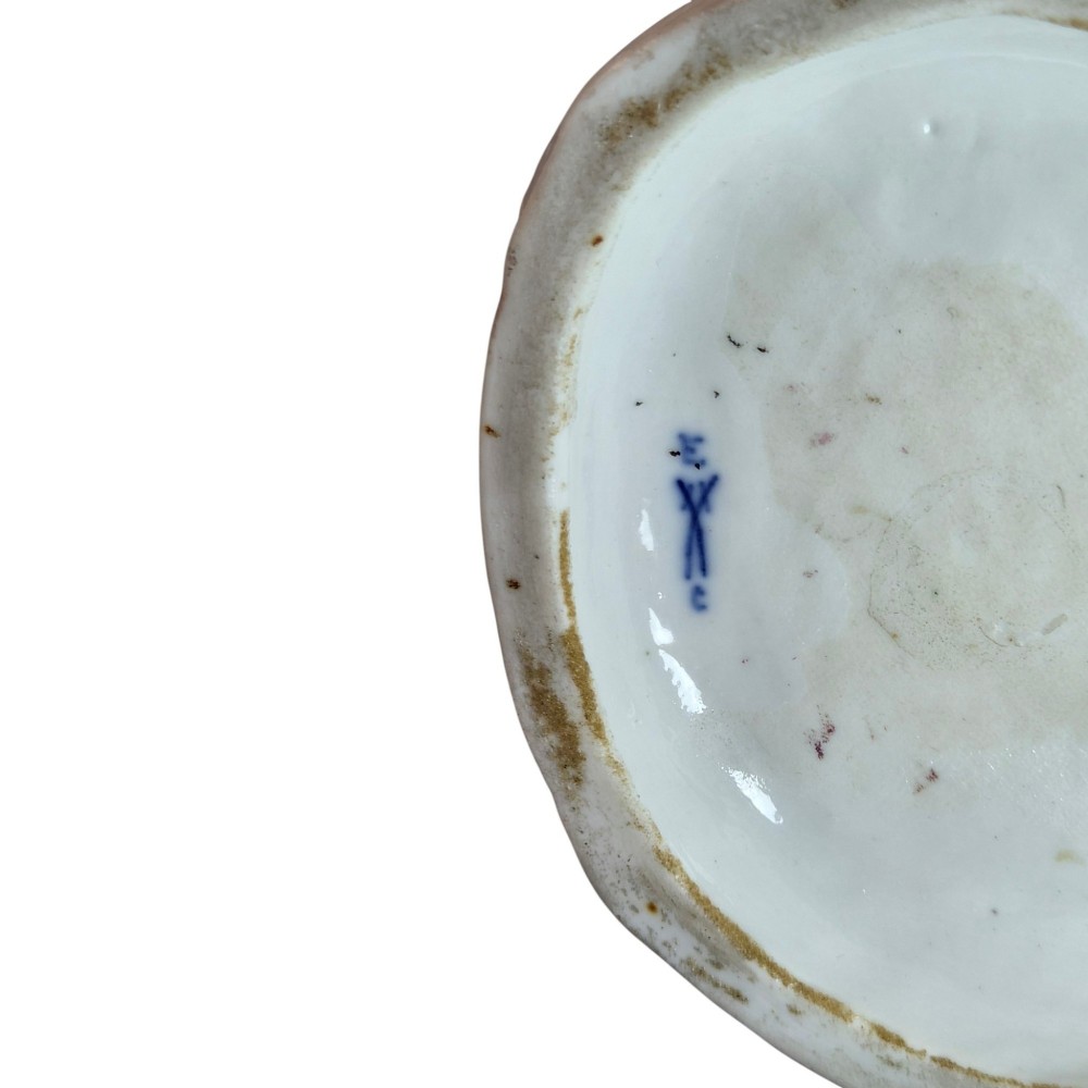 A 19th-century Paris porcelain figural group depicting a man standing behind a seated woman playing a harp, featuring porcelain lace trim and gold scrollwork. View X