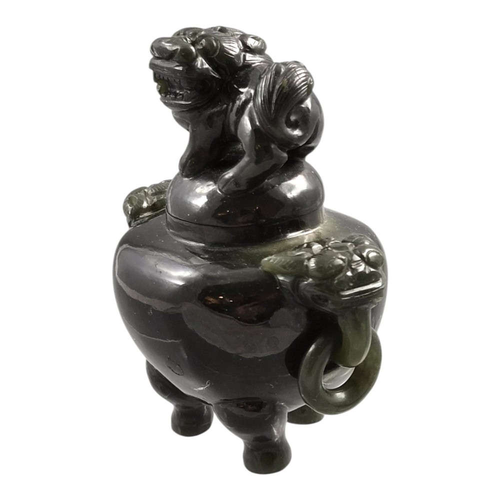 A hand-carved dark green jade tripod censer featuring a foo dog lid finial and lion mask handles with carved loose rings. View III