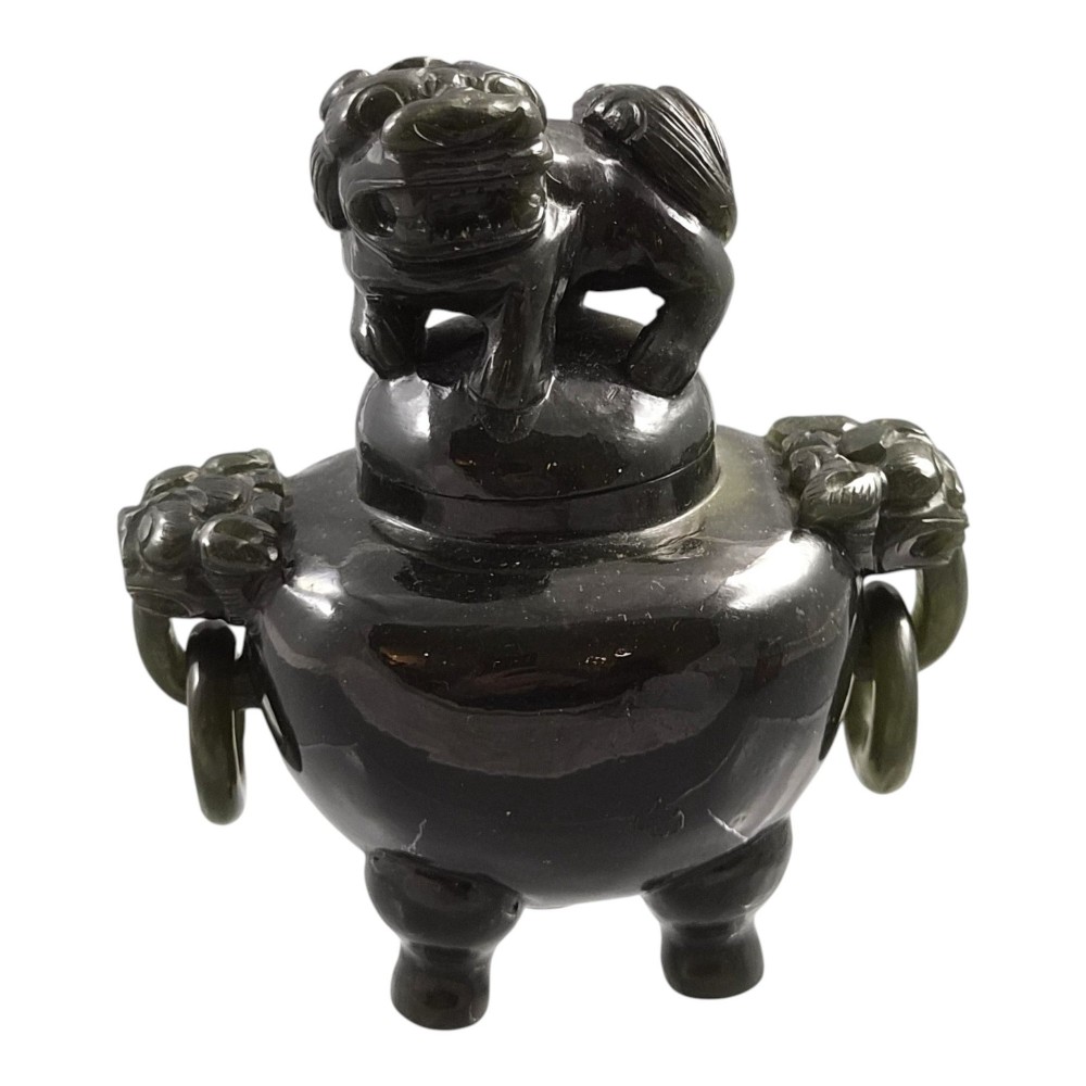A hand-carved dark green jade tripod censer featuring a foo dog lid finial and lion mask handles with carved loose rings. View VIII