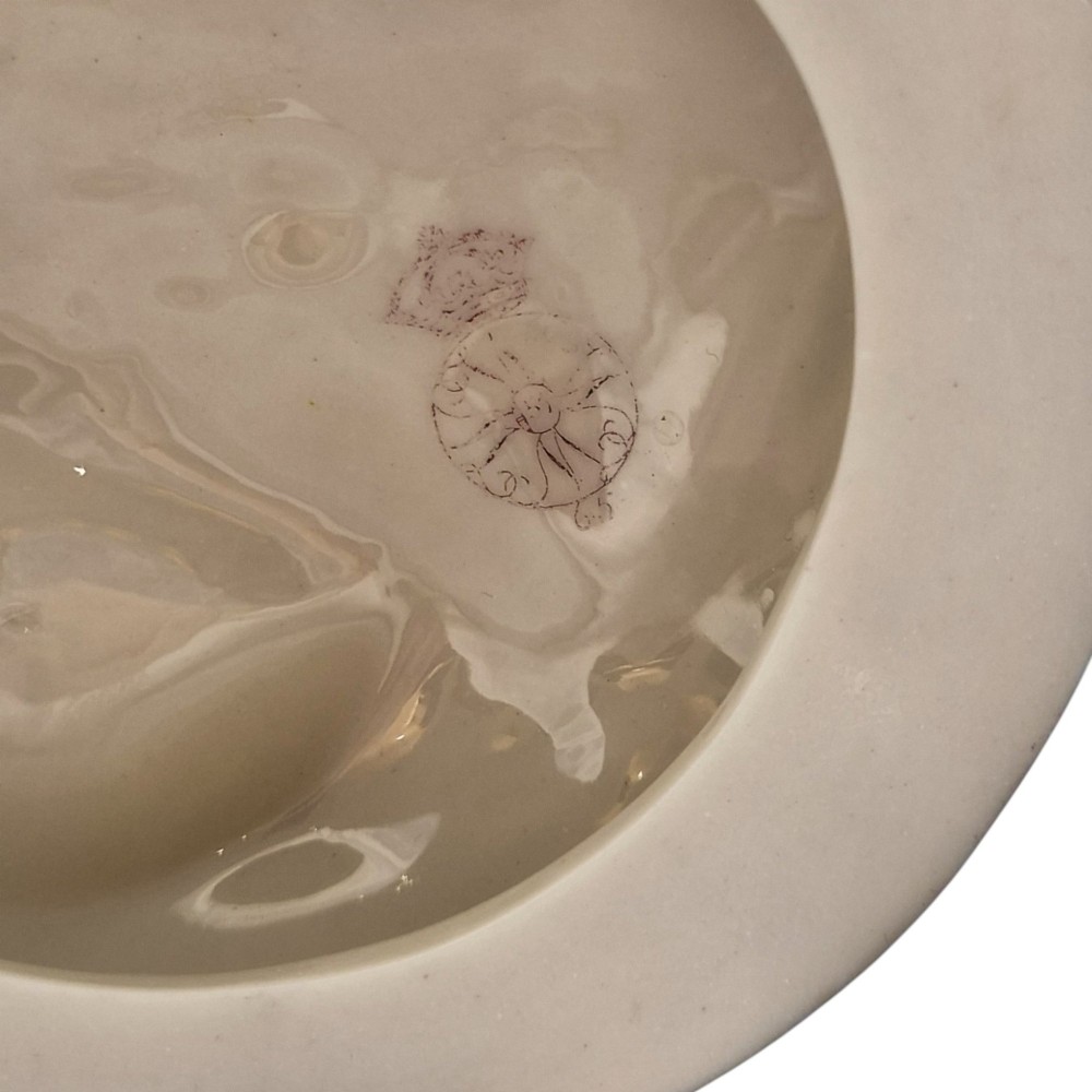 A pair of Victorian cream-glazed porcelain figures depicting classical female forms with flowing drapery set on circular bases. View VIII