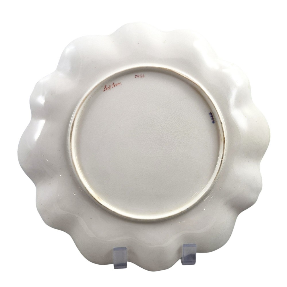 A set of four late nineteenth-century Aynsley porcelain cabinet plates featuring hand-painted landscape scenes surrounded by cobalt blue rims with heavy gold foliage gilding. View III