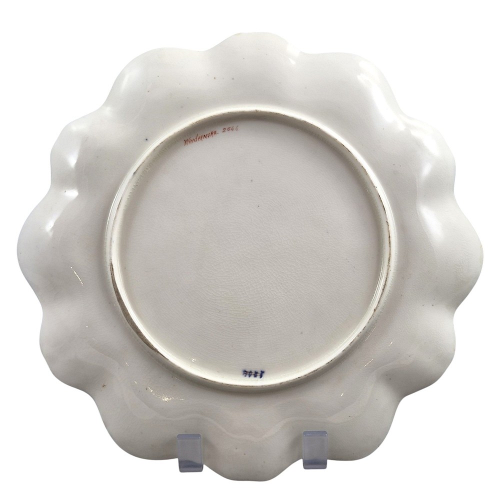 A set of four late nineteenth-century Aynsley porcelain cabinet plates featuring hand-painted landscape scenes surrounded by cobalt blue rims with heavy gold foliage gilding. View IX