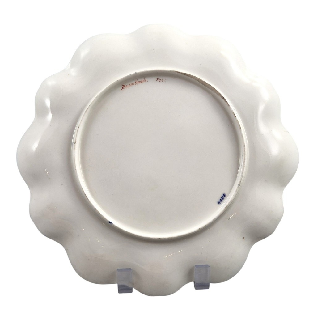 A set of four late nineteenth-century Aynsley porcelain cabinet plates featuring hand-painted landscape scenes surrounded by cobalt blue rims with heavy gold foliage gilding. View XIV