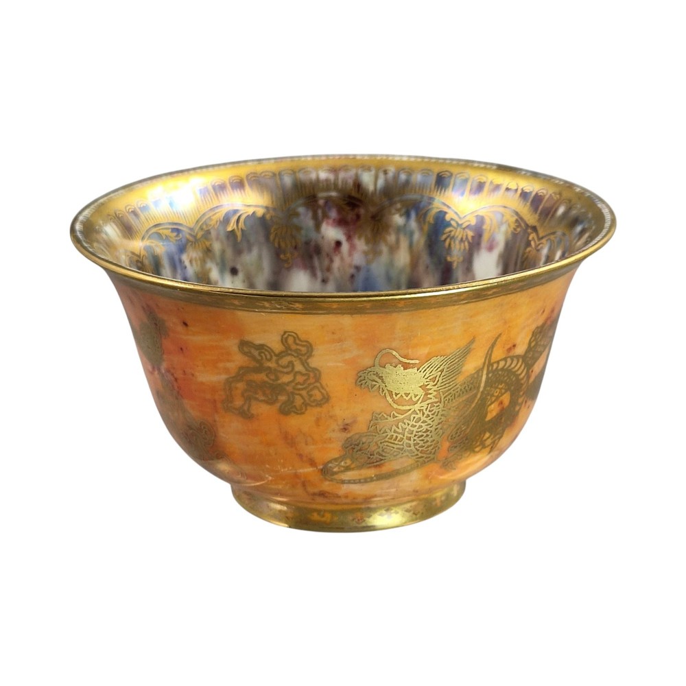 An antique ceramic bowl with a mottled orange lustre glaze on the exterior, decorated with a gold gilded dragon, and a pearlescent interior with a gilded scalloped border. View III