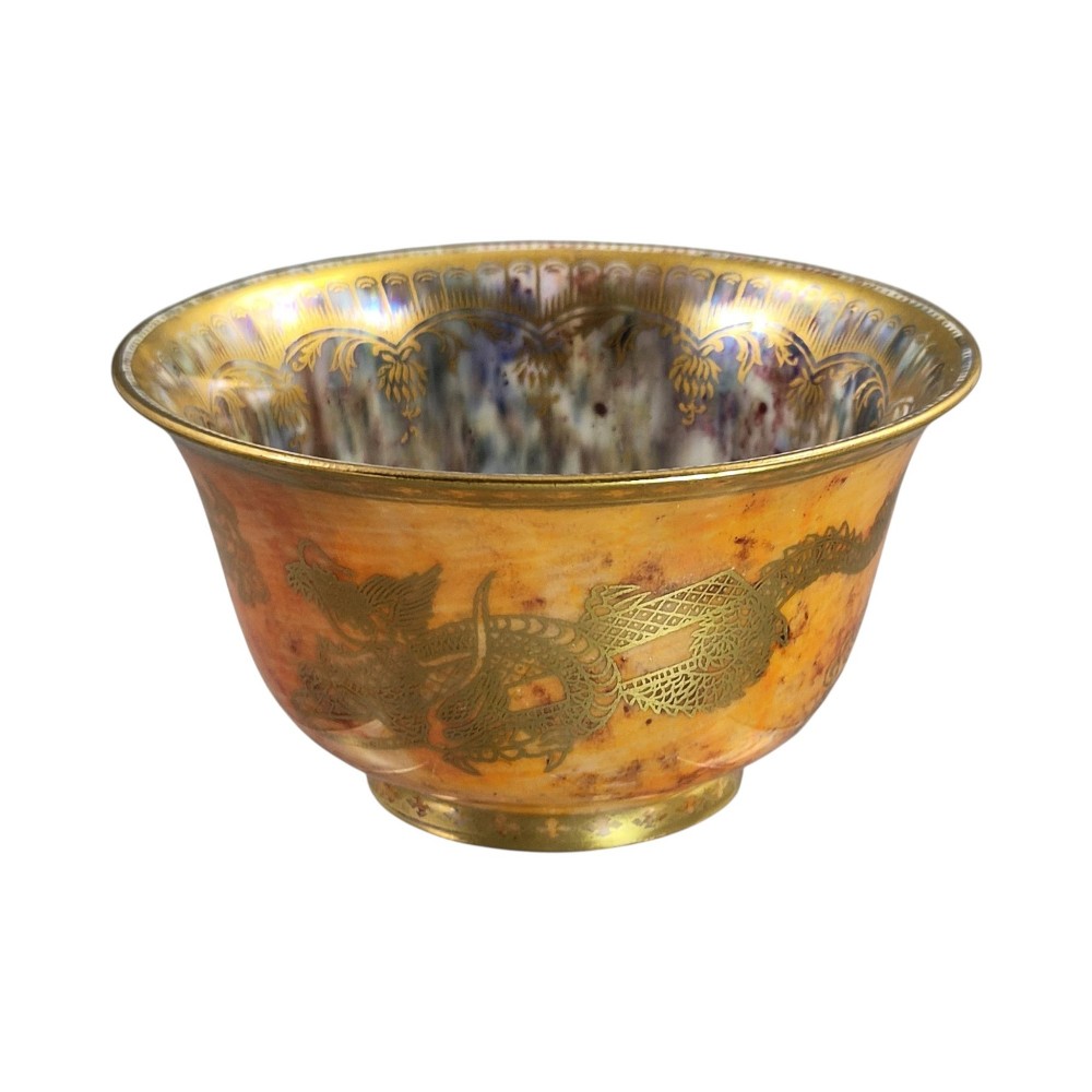 An antique ceramic bowl with a mottled orange lustre glaze on the exterior, decorated with a gold gilded dragon, and a pearlescent interior with a gilded scalloped border. View IV