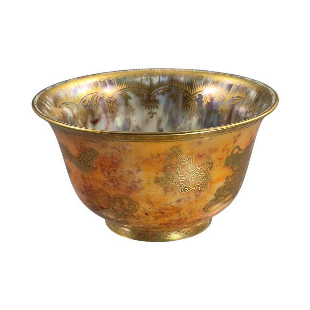 An antique ceramic bowl with a mottled orange lustre glaze on the exterior, decorated with a gold gilded dragon, and a pearlescent interior with a gilded scalloped border. View VI