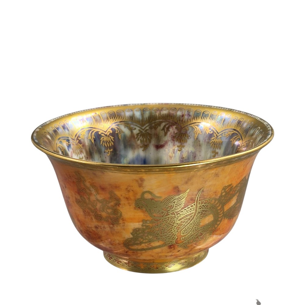 An antique ceramic bowl with a mottled orange lustre glaze on the exterior, decorated with a gold gilded dragon, and a pearlescent interior with a gilded scalloped border. View VII