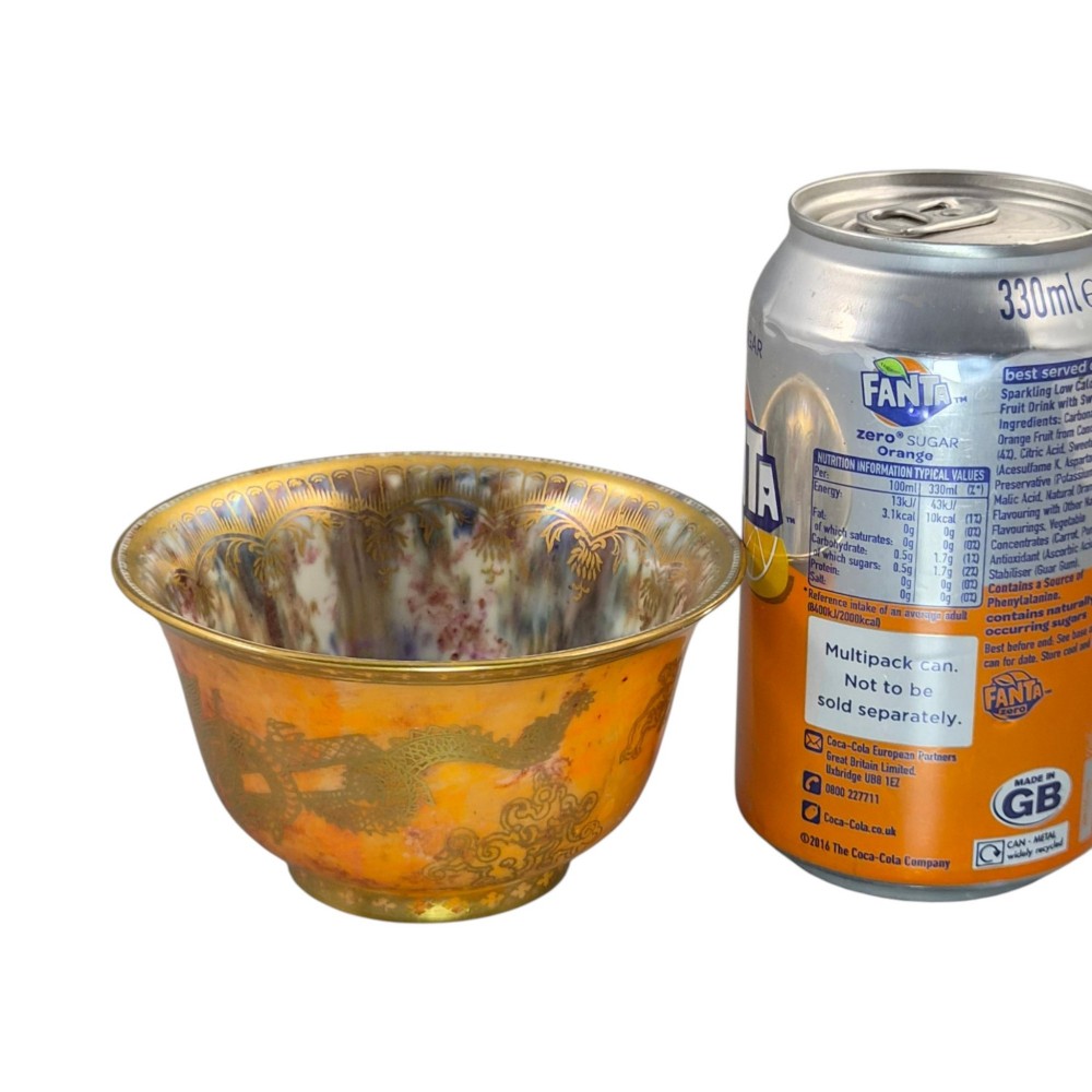 An antique ceramic bowl with a mottled orange lustre glaze on the exterior, decorated with a gold gilded dragon, and a pearlescent interior with a gilded scalloped border. View XIV