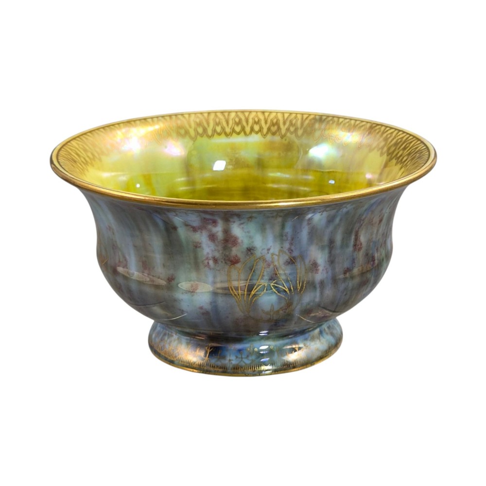 An iridescent blue footed porcelain bowl with gilded dragon motifs and a patterned gold interior rim. View II