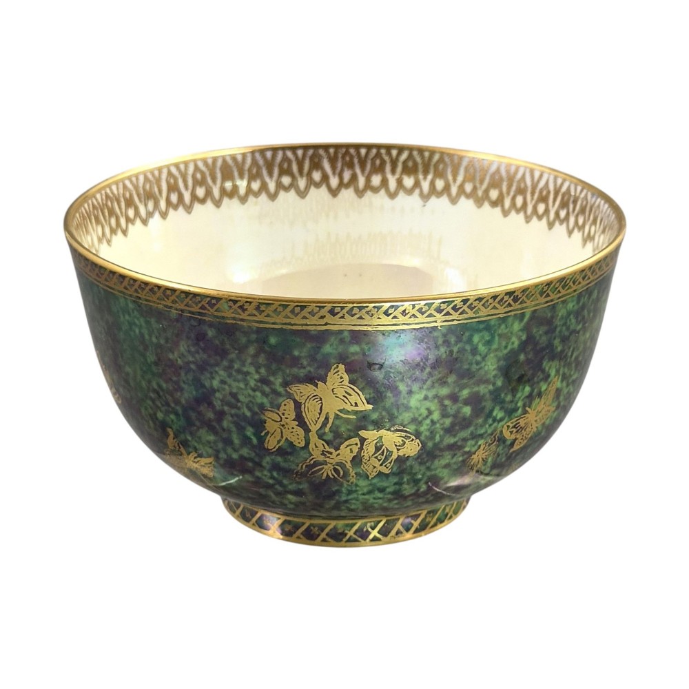 A deep porcelain bowl featuring a mottled green iridescent exterior decorated with gilded butterflies and geometric gold borders around the rim and base. View VI
