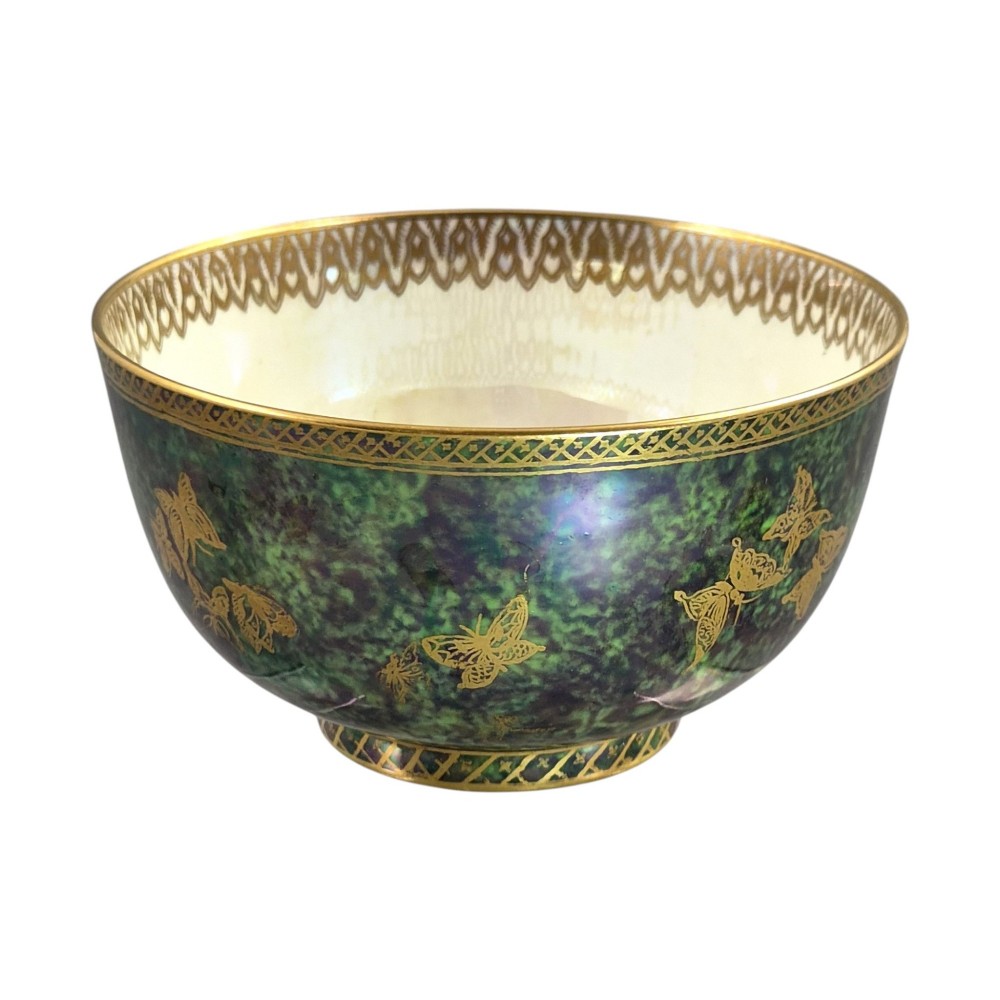 A deep porcelain bowl featuring a mottled green iridescent exterior decorated with gilded butterflies and geometric gold borders around the rim and base. View VII
