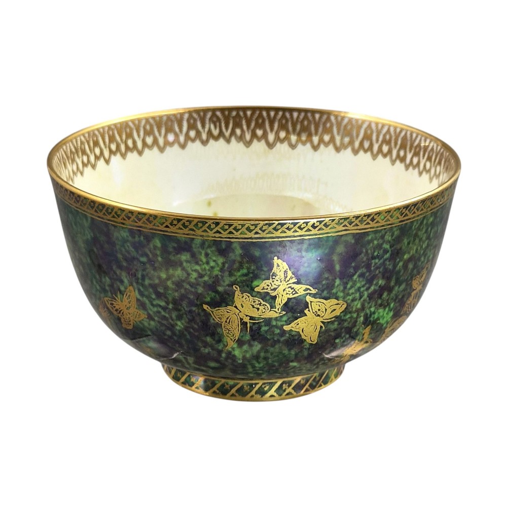 A deep porcelain bowl featuring a mottled green iridescent exterior decorated with gilded butterflies and geometric gold borders around the rim and base. View VIII