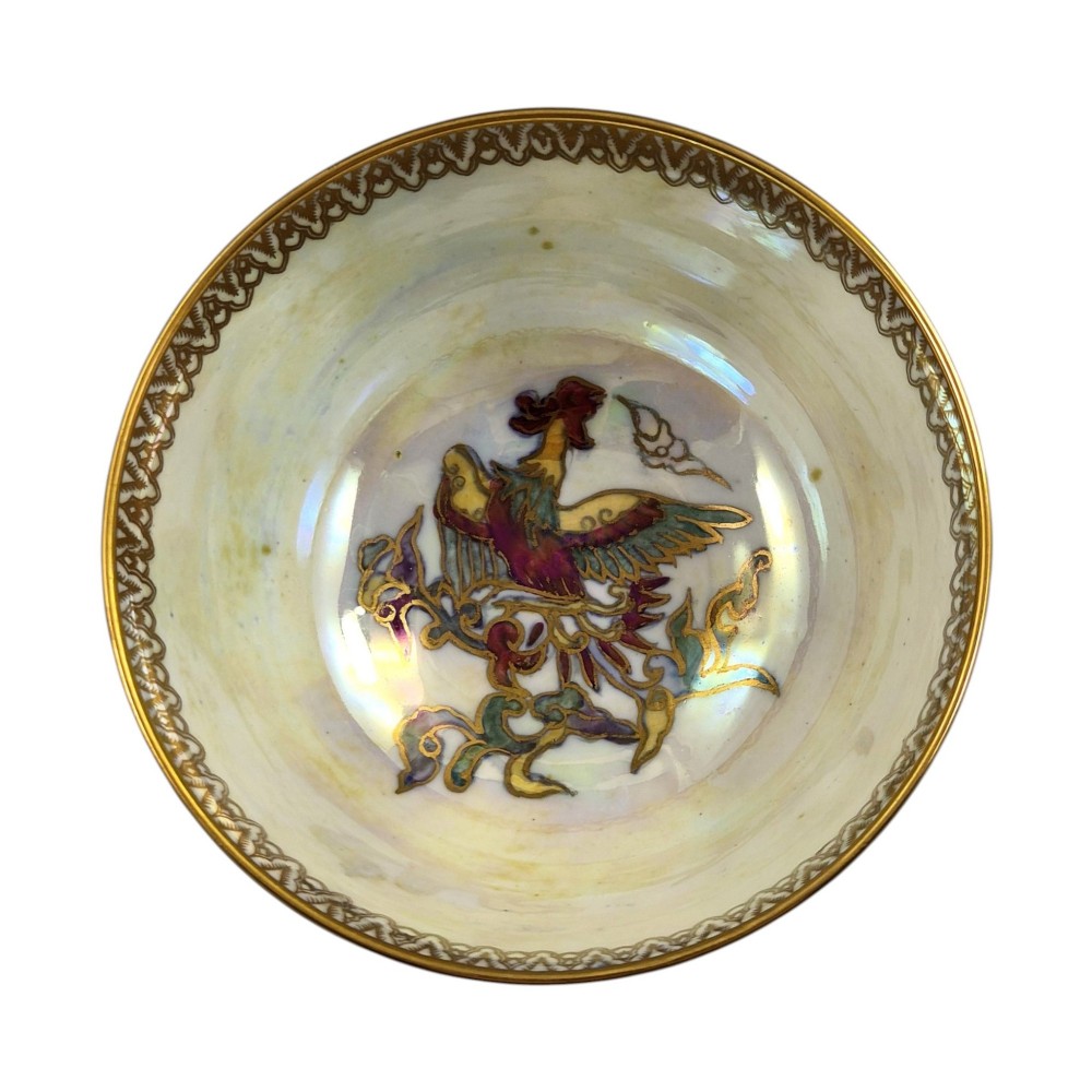 A deep porcelain bowl featuring a mottled green iridescent exterior decorated with gilded butterflies and geometric gold borders around the rim and base. View X
