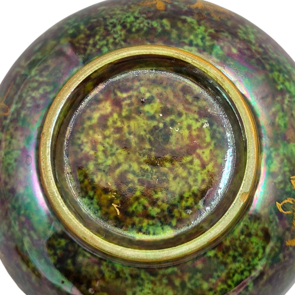 A deep porcelain bowl featuring a mottled green iridescent exterior decorated with gilded butterflies and geometric gold borders around the rim and base. View XI