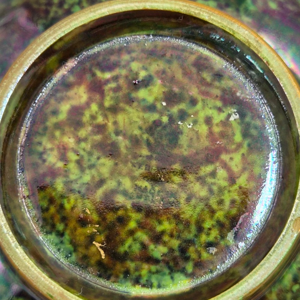 A deep porcelain bowl featuring a mottled green iridescent exterior decorated with gilded butterflies and geometric gold borders around the rim and base. View XII