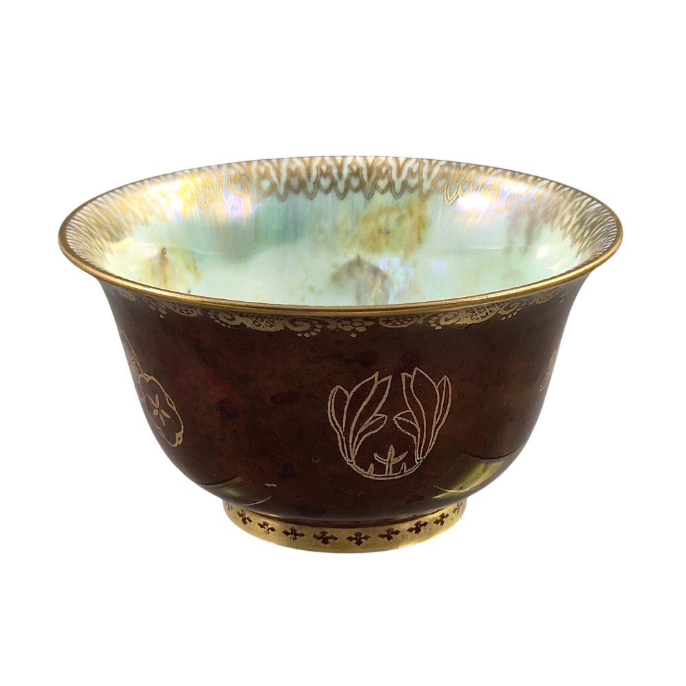 A deep red ceramic bowl with a flared rim, featuring gilded motifs on the exterior and an iridescent opalescent glazed interior. View IV