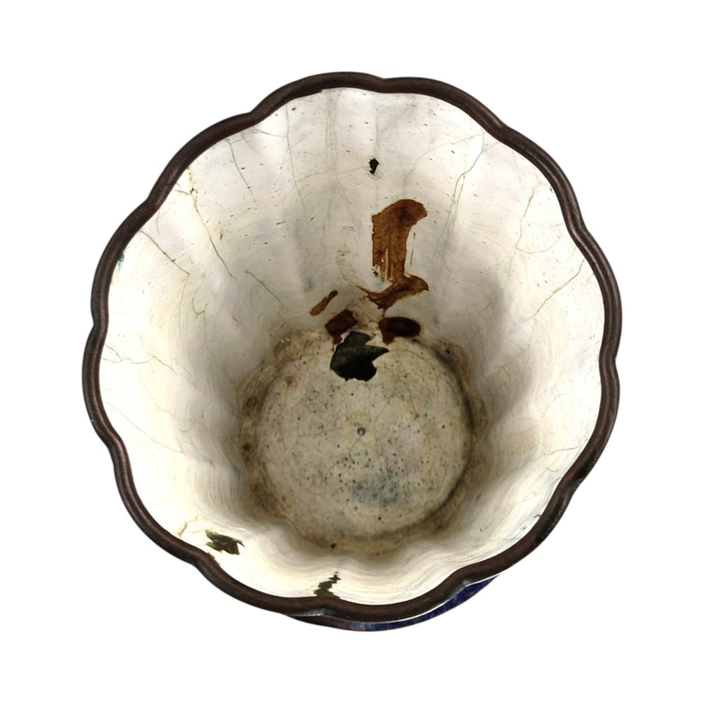 A flared cobalt blue Canton enamel copper vessel painted with a central panel depicting Chinese figures in a courtyard setting. View VI