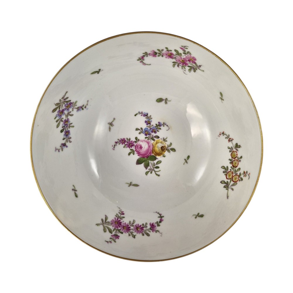 A late 19th-century Samson hard-paste porcelain footed bowl featuring a cobalt blue band with gilded leaf details, hand-painted floral cartouches, and a white brick-patterned base. View II