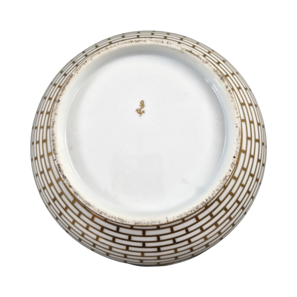 A late 19th-century Samson hard-paste porcelain footed bowl featuring a cobalt blue band with gilded leaf details, hand-painted floral cartouches, and a white brick-patterned base. View III